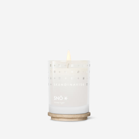 Skandinavisk SNÖ 65g Scented Candle scented candle — available at Tegrino Studio with Bang & Olufsen speaker covers