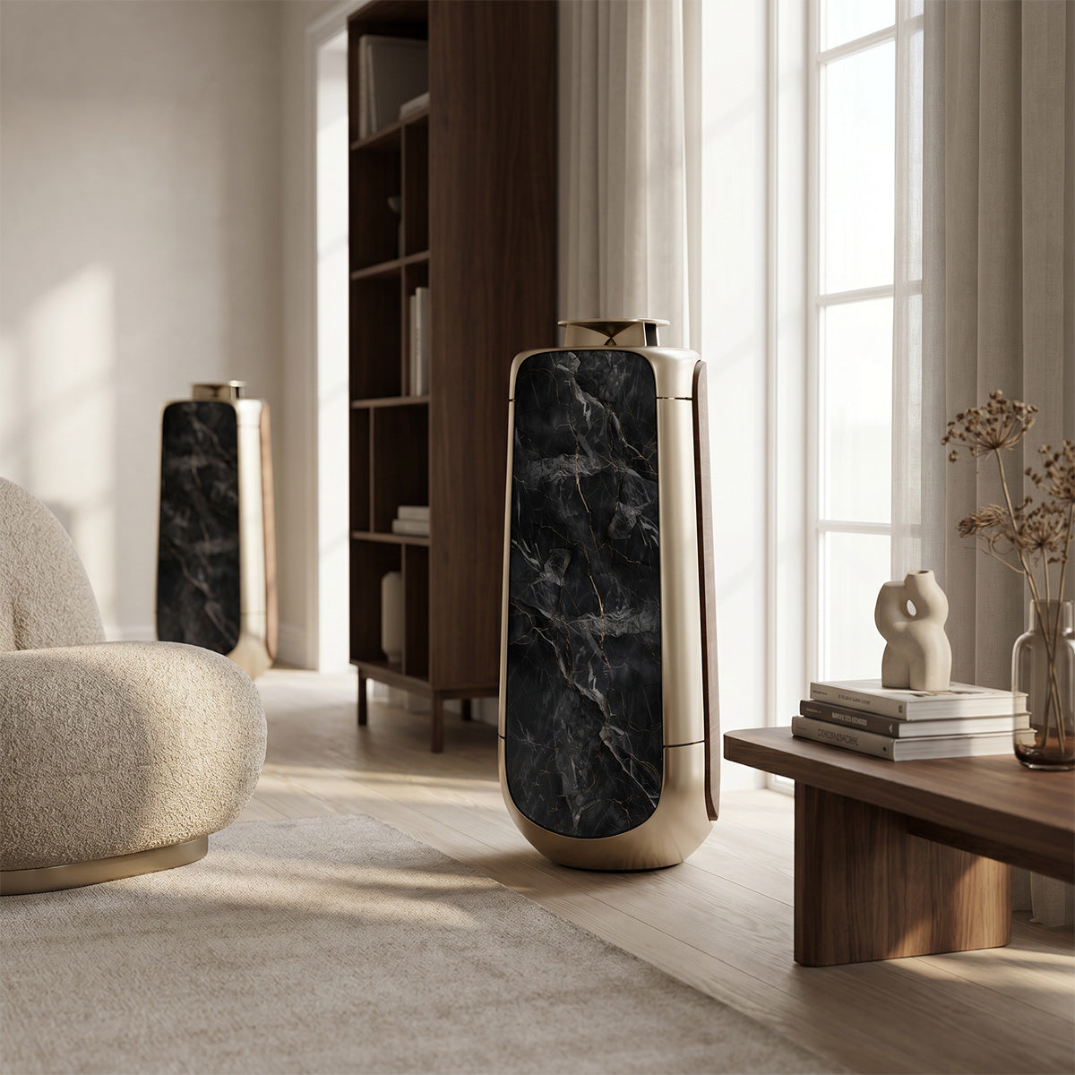 Bang & Olufsen BeoLab 50 speakers with Noir Marquina black marble skin displayed in warm living room beside walnut bookshelf, boucle armchair, and dried floral arrangement