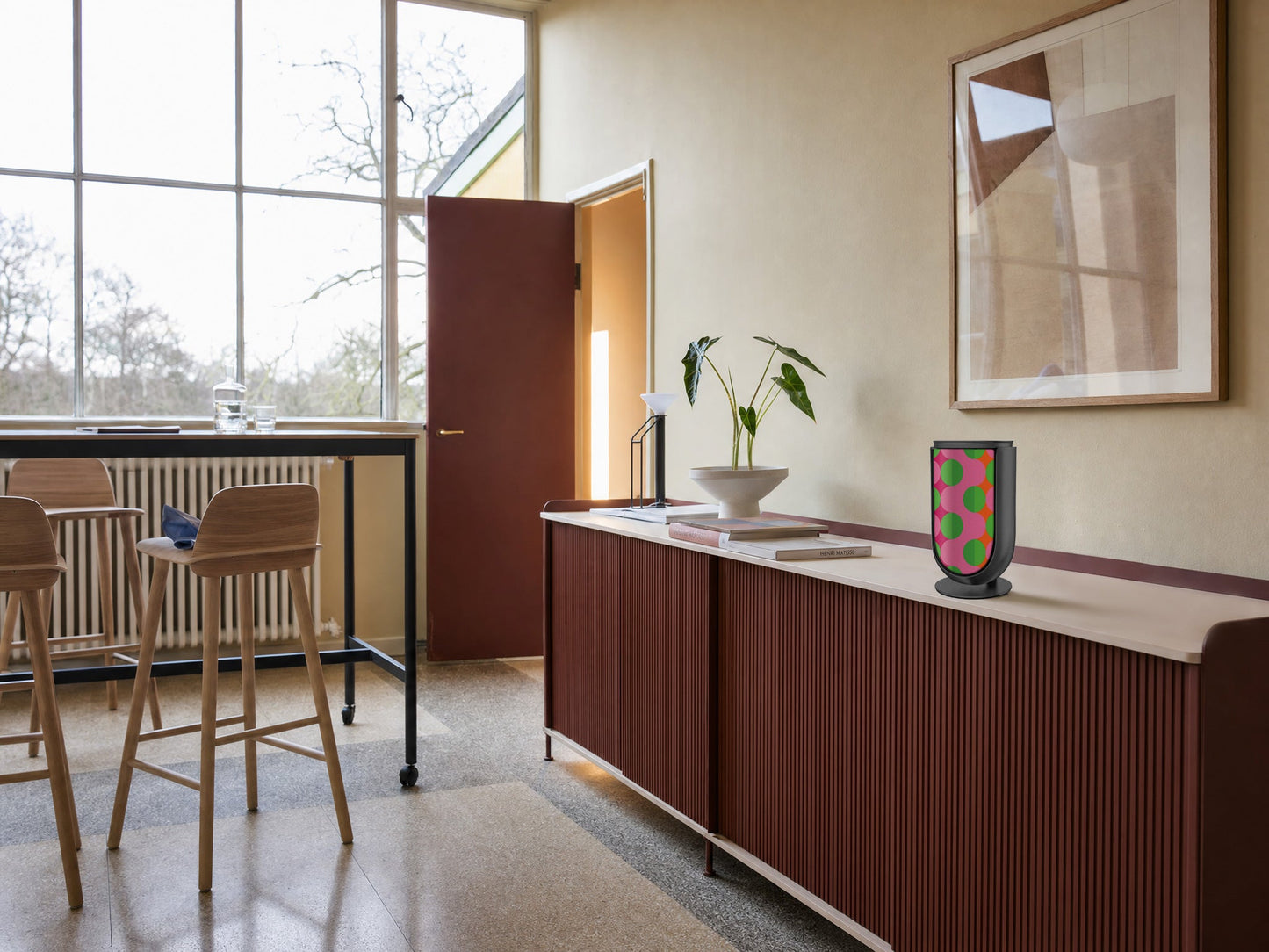 Bang & Olufsen BeoLab 8 with the Summer Beat cover by Tegrino Studio on a deep red fluted sideboard