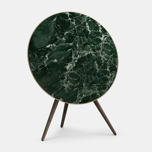Bang & Olufsen BeoPlay A9 and BeoSound A9 cover replacement featuring Verde St. Denis deep green marble pattern with white veining, printed on acoustically transparent fabric, wooden tripod stand, front view on white background