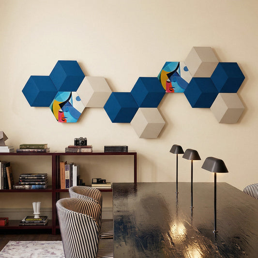 Bang & Olufsen BeoSound Shape speaker cover replacement Éclat — Cubist Portrait by Tegrino Studio in a refined interior composition, featuring cubist abstract face tiles mixed with solid navy blue and warm beige hexagonal panels on cream wall above dark dining table with striped armchair
