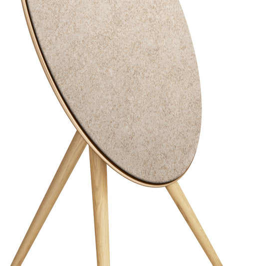 Bang & Olufsen Beoplay A9 and Beosound A9 Kvadrat Woolscape cover Golden by Bang & Olufsen, close-up detail of the pale gold knitted wool texture and the lower edge of the cover
