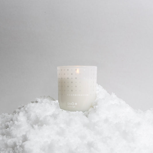 Skandinavisk SNÖ 65g Scented Candle scented candle — available at Tegrino Studio with Bang & Olufsen speaker covers