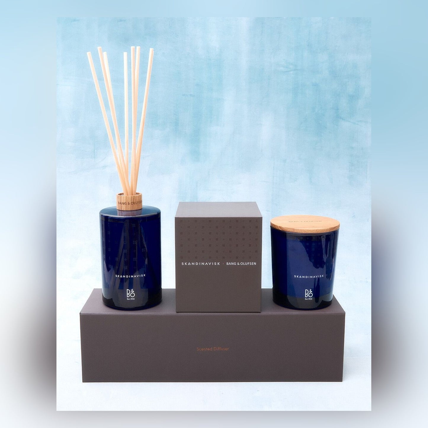 Bang & Olufsen x Skandinavisk centenary set — scented candle with embossed oak lid and reed diffuser with presentation boxes