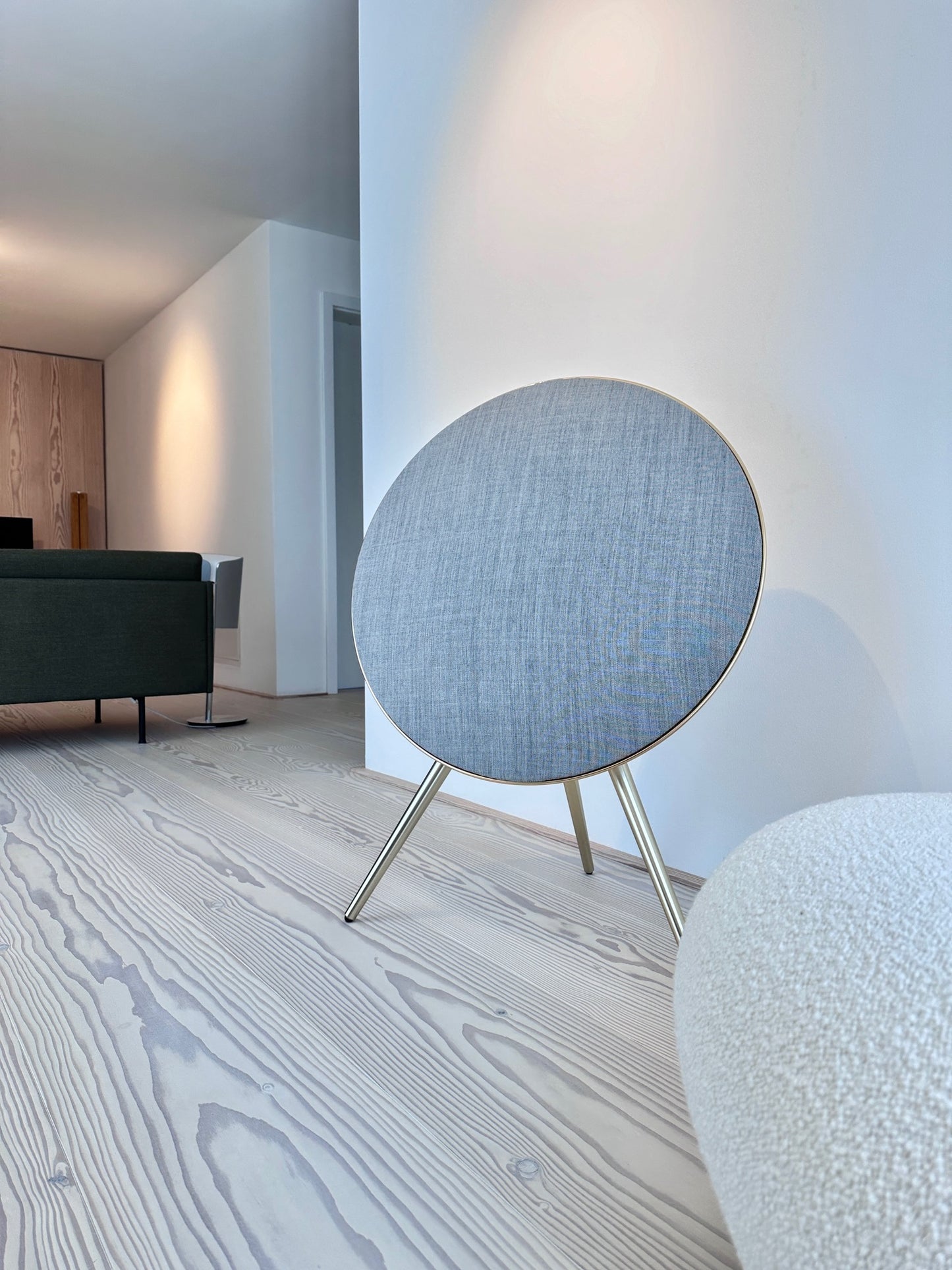 BeoPlay A9 and BeoSound A9 speaker with Light Grey Kvadrat cover by Bang & Olufsen in a softly styled interior, showcasing acoustically transparent wool blend textile in soft neutral grey finish