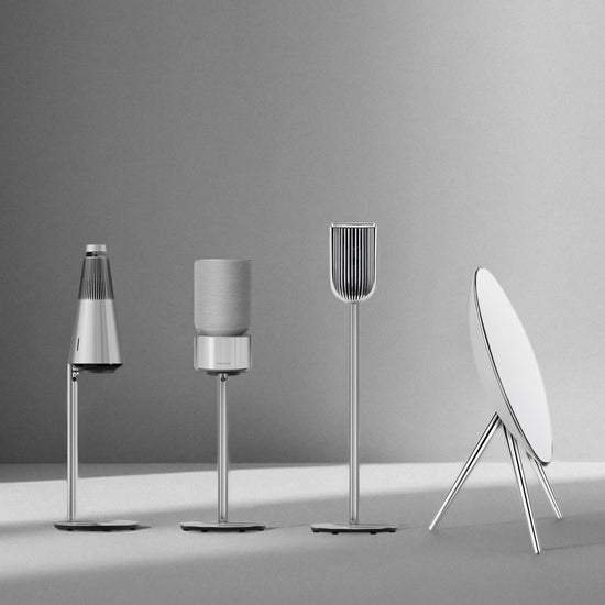Bang & Olufsen speaker stand collection by Tegrino Studio featuring BeoSound 2, BeoSound Balance, BeoLab 8 and BeoPlay A9 and BeoSound A9 floor stands in silver aluminium finish, monochrome studio shot on grey gradient background