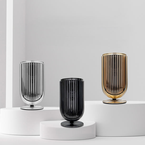 Bang & Olufsen BeoLab 8 aluminium cover collection by Tegrino Studio featuring Silver, Black and Gold Tone dual-layer anodised finishes with 219 precision cuts displayed on white pedestals