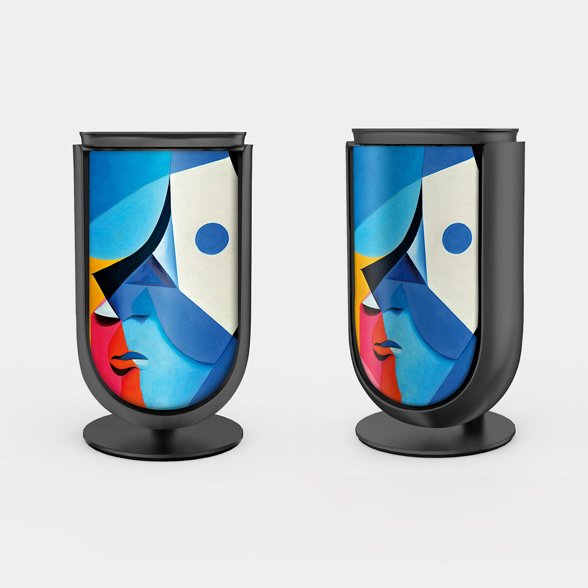 Bang & Olufsen BeoLab 8 speaker covers Éclat — Cubist Portrait by Tegrino Studio featuring cubist abstract face in vivid blue, yellow, pink and red geometric planes on stereo pair with black aluminium frame, printed on acoustically transparent fabric