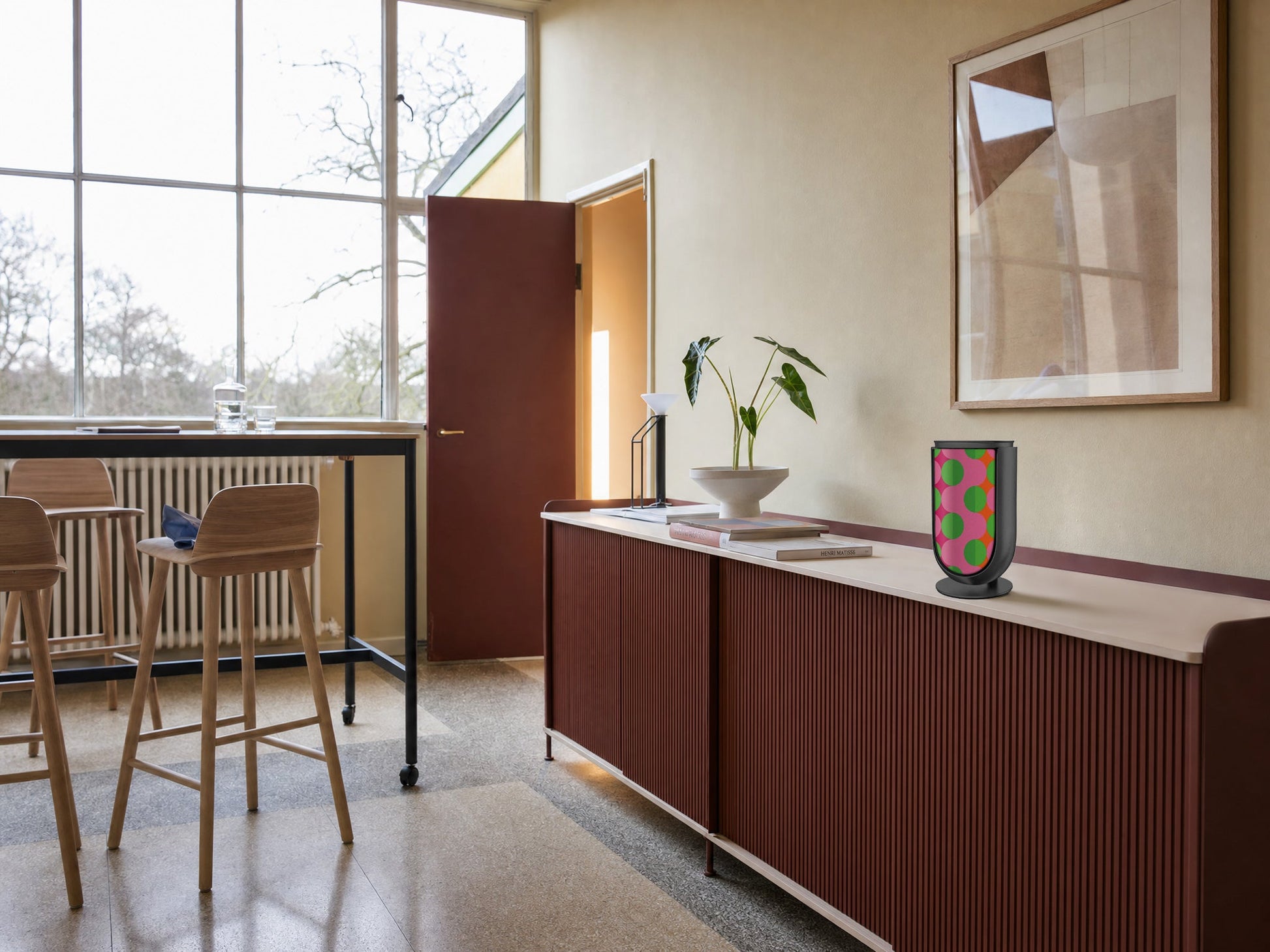 Bang & Olufsen BeoLab 8 with the Summer Beat cover by Tegrino Studio on a deep red fluted sideboard