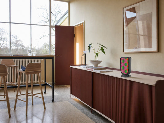 Bang & Olufsen BeoLab 8 with the Summer Beat cover by Tegrino Studio on a deep red fluted sideboard