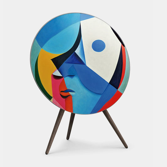 Bang & Olufsen BeoPlay A9 and BeoSound A9 speaker cover Éclat — Cubist Portrait by Tegrino Studio featuring cubist abstract face in vivid blue, yellow, pink and deep green geometric planes, printed on acoustically transparent fabric