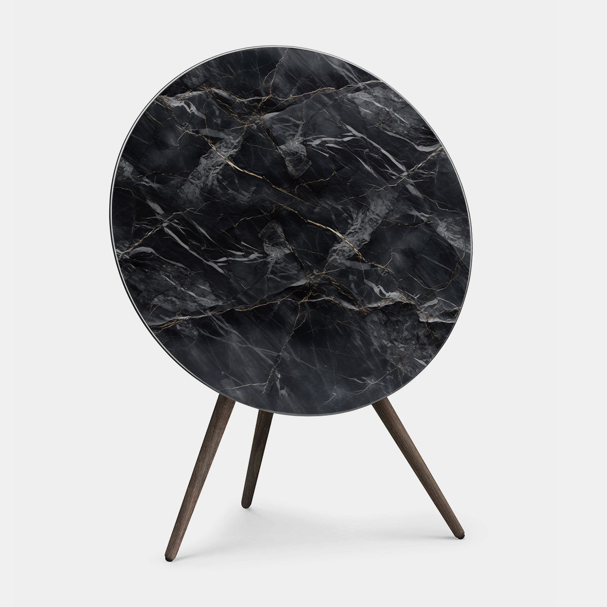 Bang & Olufsen BeoPlay A9 and BeoSound A9 cover replacement featuring Noir Marquina black marble pattern with gold veining, printed on acoustically transparent fabric, wooden tripod stand, angled product view on white background