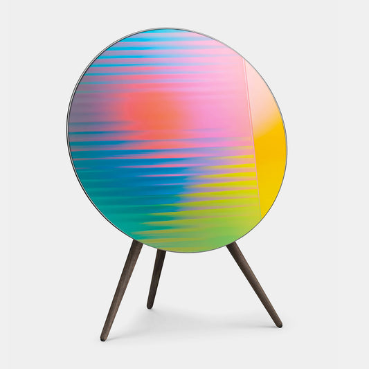 Bang & Olufsen BeoPlay A9 and BeoSound A9 speaker cover replacement Prism by Tegrino Studio featuring full-spectrum gradient with horizontal scan lines shifting from coral pink through sky blue, teal and chartreuse yellow, printed on acoustically transparent fabric