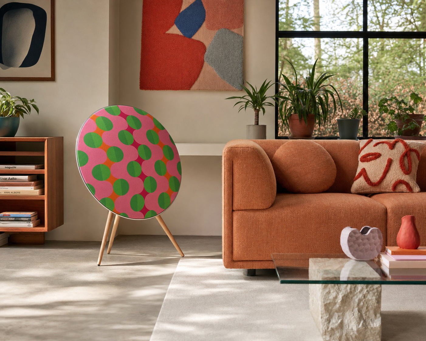 Bang & Olufsen BeoPlay A9 with the Summer Beat cover by Tegrino Studio in a sunlit living room beside an orange sofa