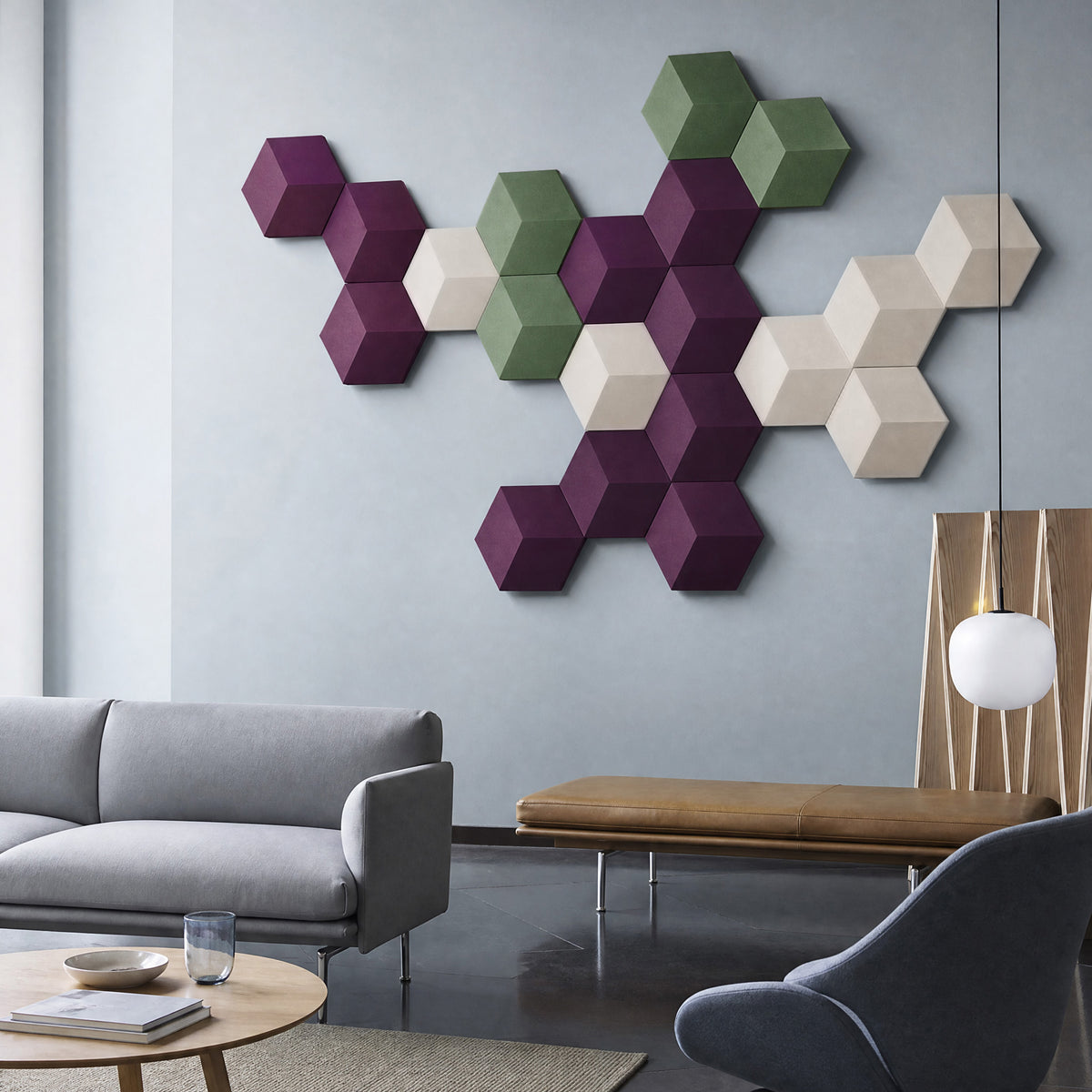 Bang & Olufsen Beosound Shape with Damson covers by Tegrino Studio, mixed with olive green and off-white tiles on a grey wall above a sofa