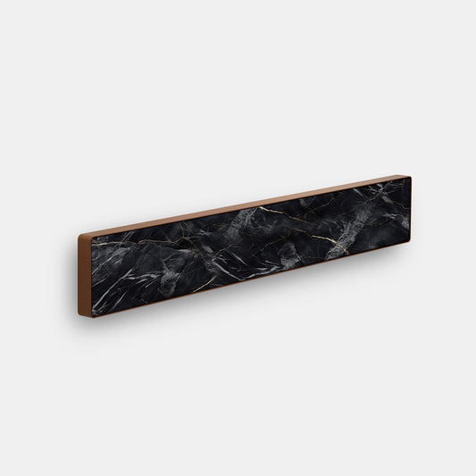 Bang & Olufsen BeoSound Stage cover replacement featuring Noir Marquina black marble pattern with gold veining, copper trim edge, printed on acoustically transparent fabric, angled product view on white background