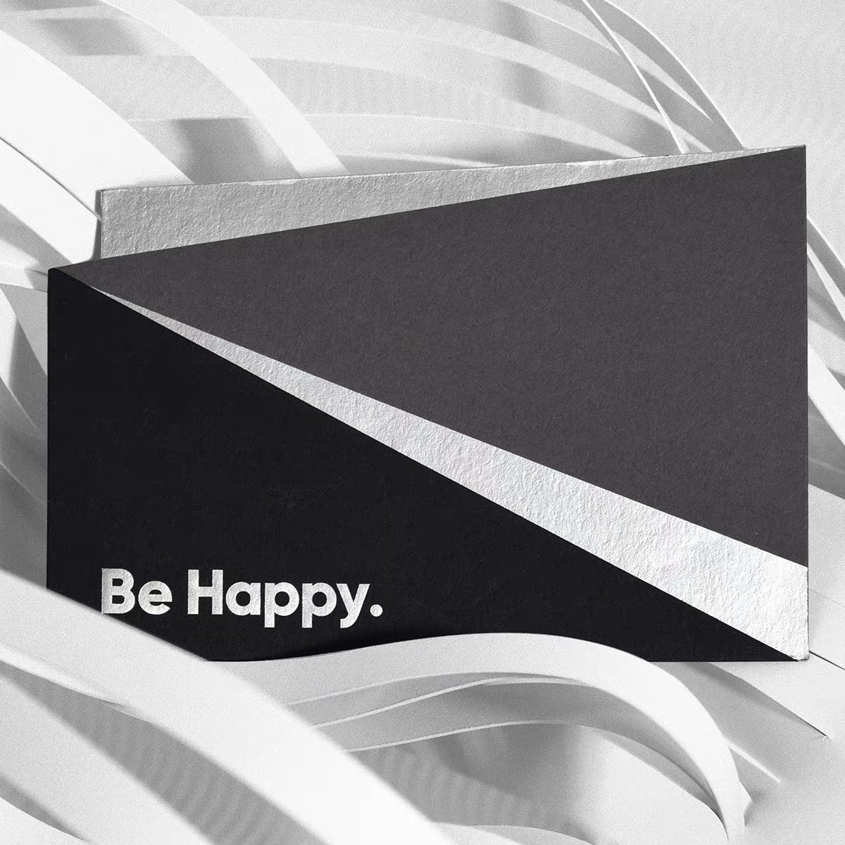 Greeting card in dark G.F Smith stock with a foiled message on the front