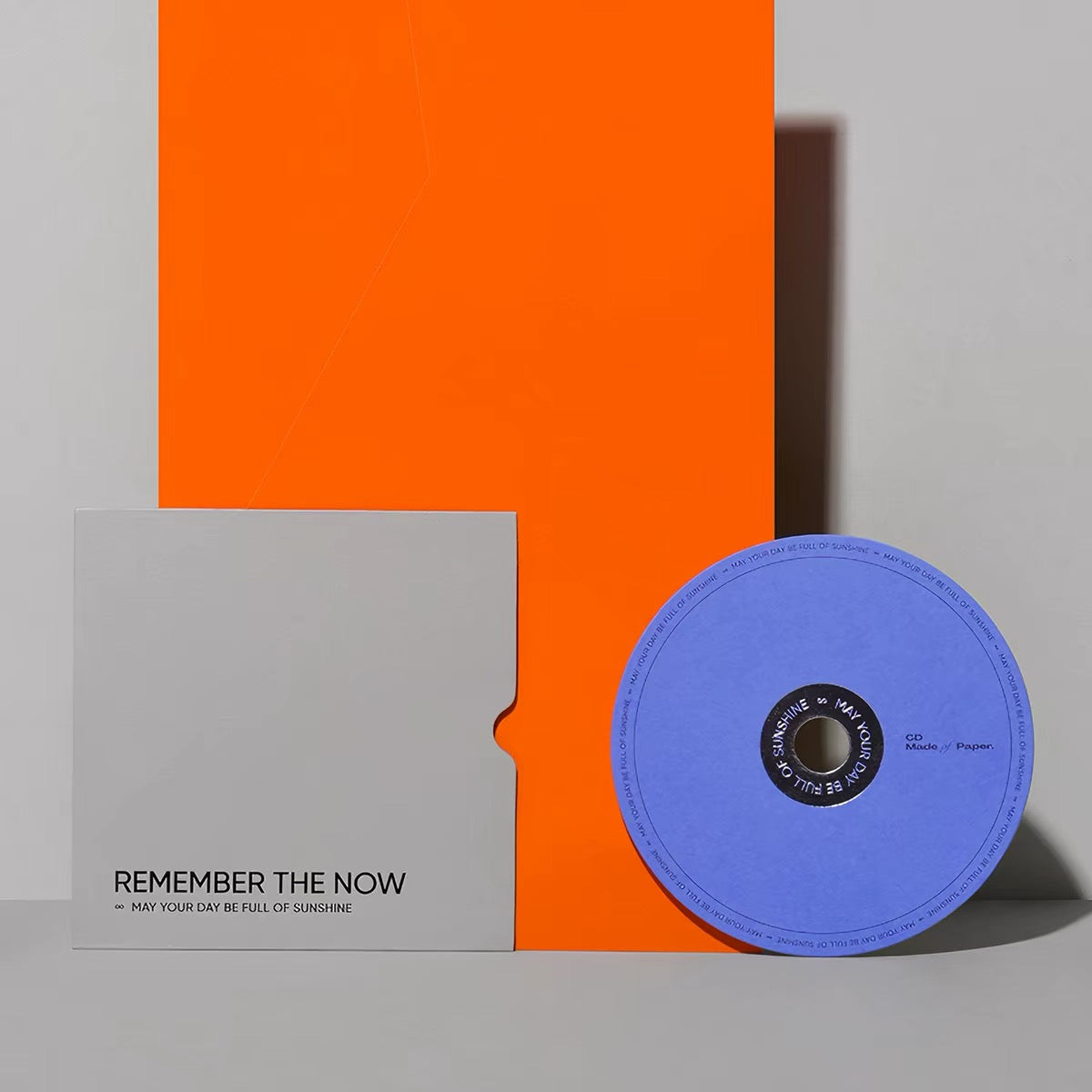 Gift card with a record-shaped insert against an orange ground