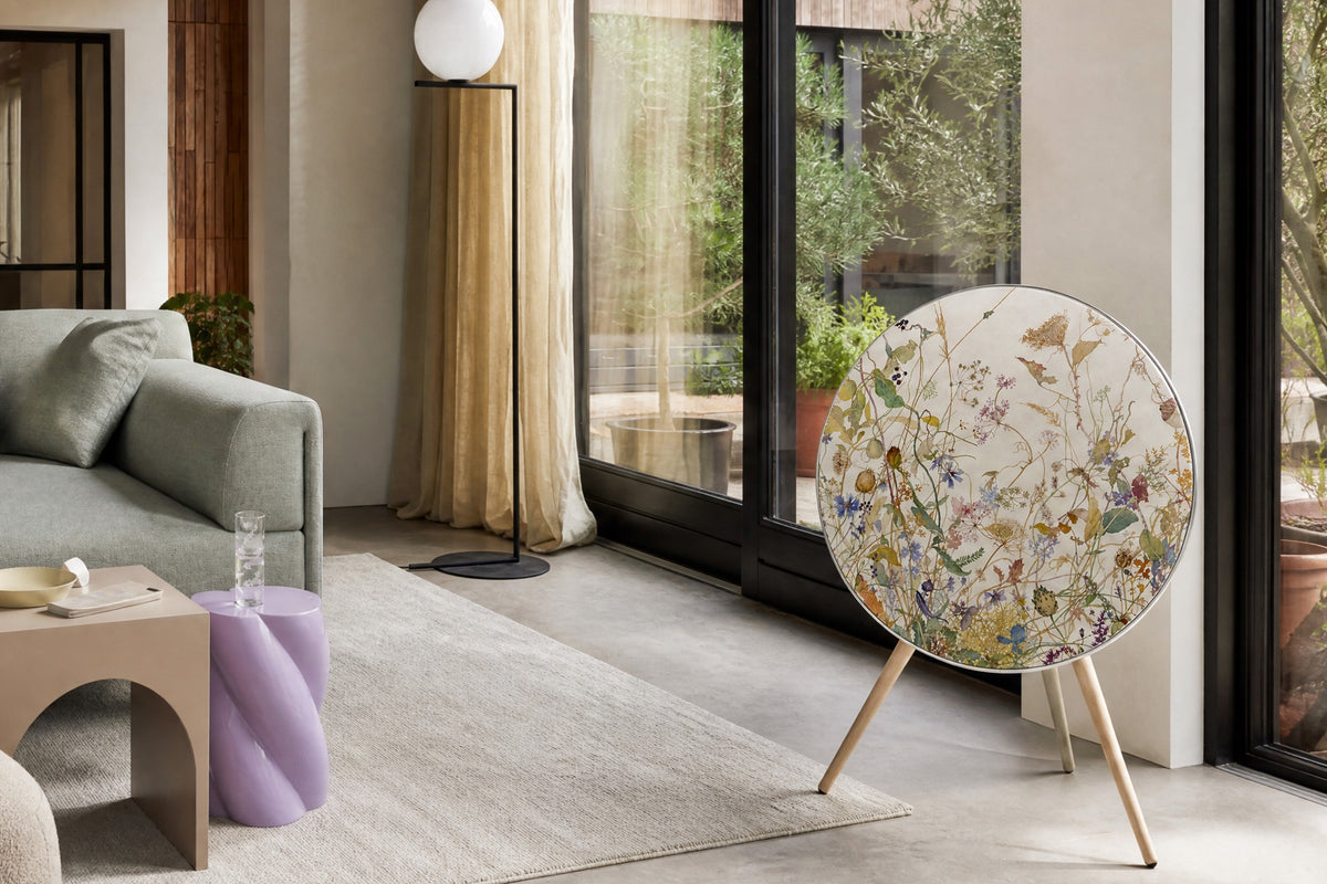 Bang & Olufsen Beoplay A9 with the Herbarium speaker cover by Tegrino Studio, beside garden doors in a bright living room