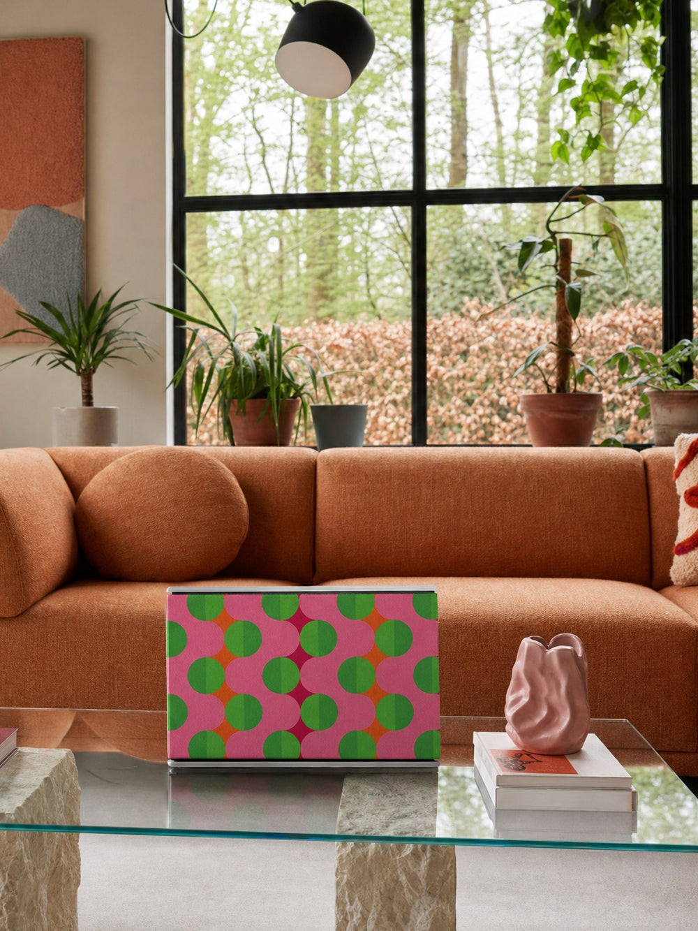 Bang & Olufsen Beosound Level with the Summer Beat speaker cover by Tegrino Studio, pink and green pattern on a glass table